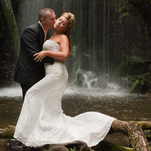 Waterfall Wedding Photography by Wedding Photographers Melbourne A bridal couple in a waterfall setting in outer Melbourne.